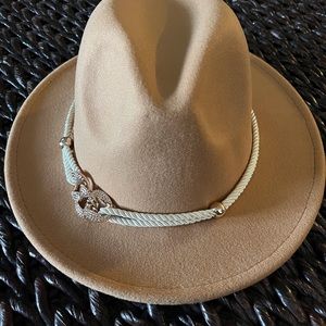 Tan Fedora hat with a beautiful rope accented adjustable band.